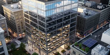 Modern office building reflecting sky, symbolizing hybrid work impact on commercial real estate